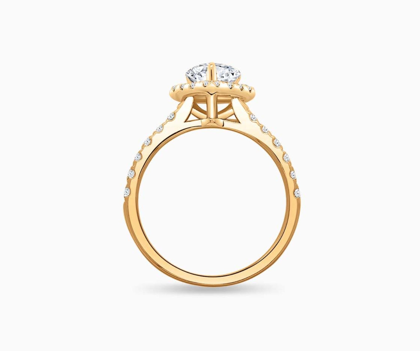side view of Pear Shaped diamond halo engagement ring set on yellow gold with a tapered pave band design