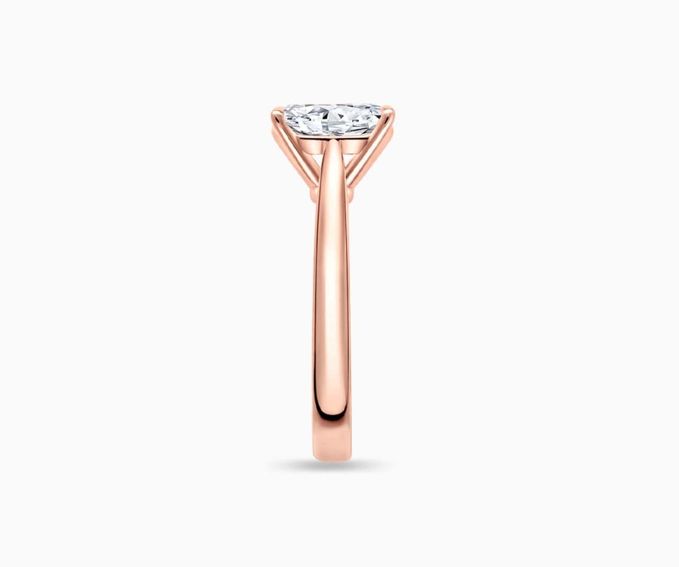 LVC solitaire ring with tapered plain band style that narrows the width towards the mount, accentuates the beauty of the centre stone in rose gold from side angle