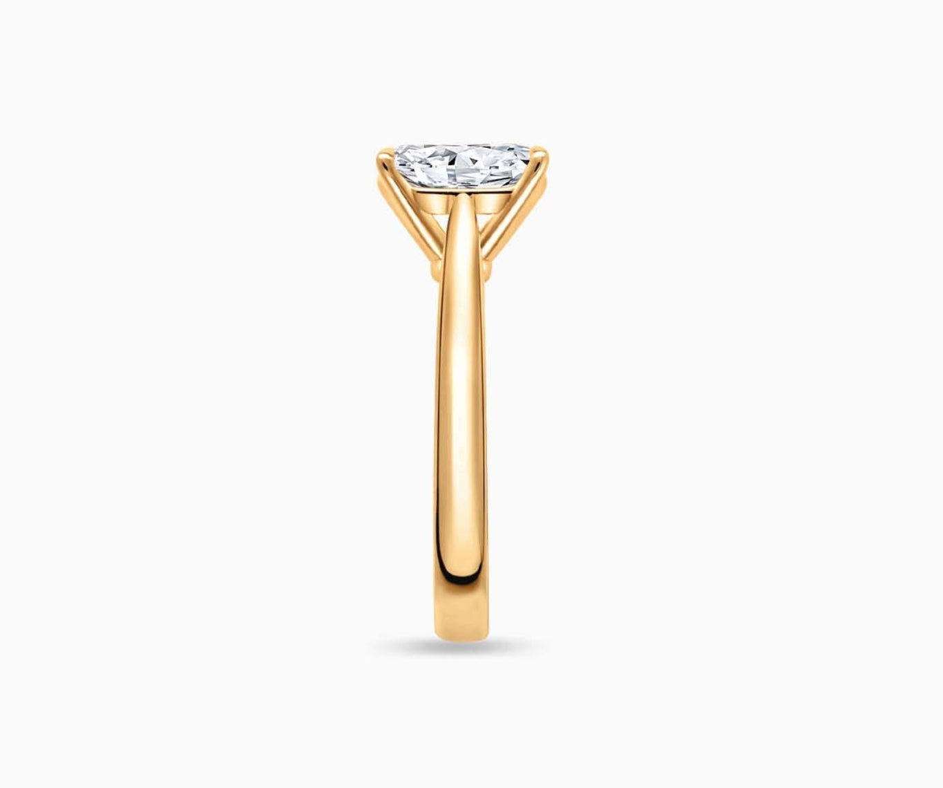 LVC solitaire ring with tapered plain band design which tapers inwards going from thick to thin and diamond on the centre in yellow gold from side angle