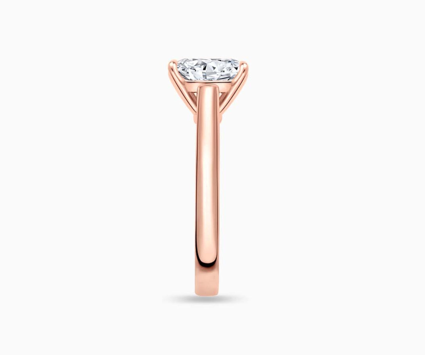 LVC solitaire ring with classic straight plain band with diamond on the centre in rose gold from side angle