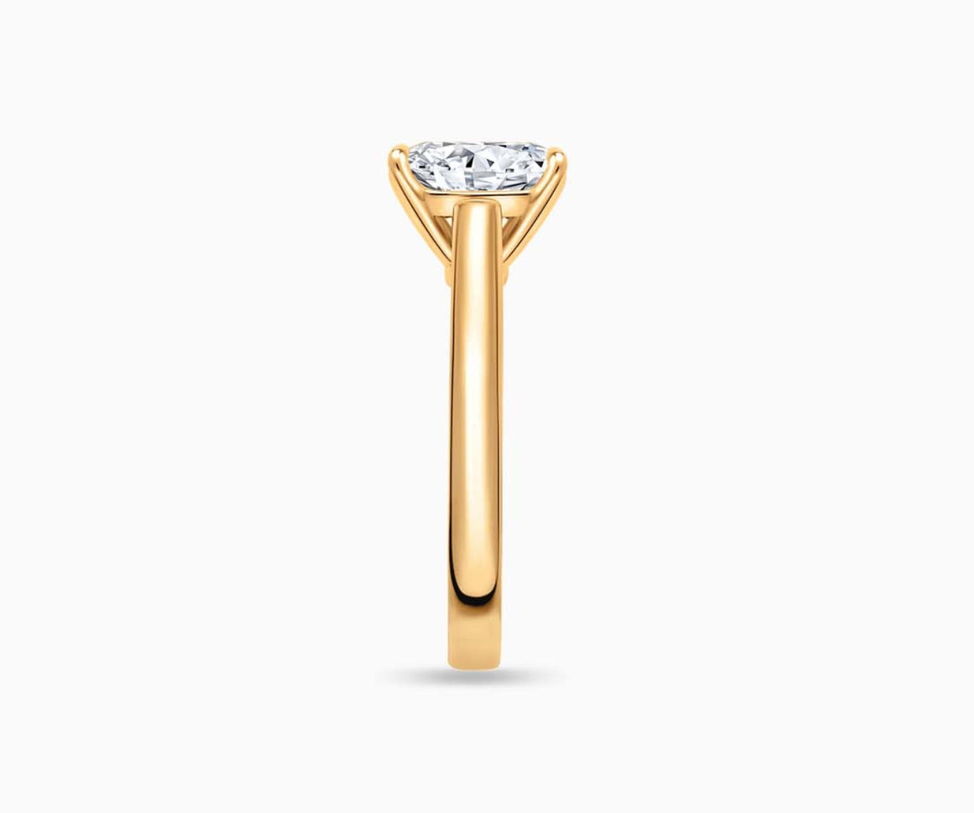 LVC solitaire ring with classic straight band and diamond on the centre in yellow gold from side angle