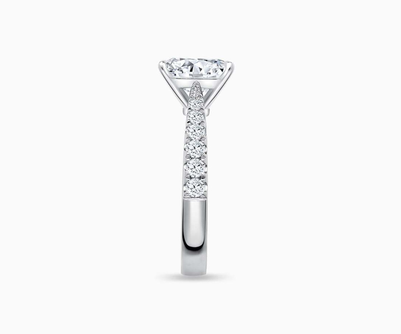 LVC solitaire ring with tapered pave band style, lined with side diamonds seen from side angle