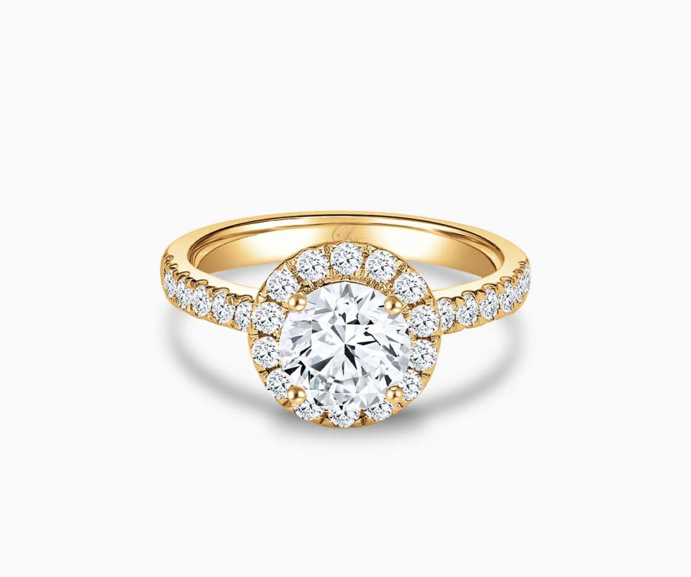 Round cut diamond halo engagement ring set on yellow gold with a straight pave band design