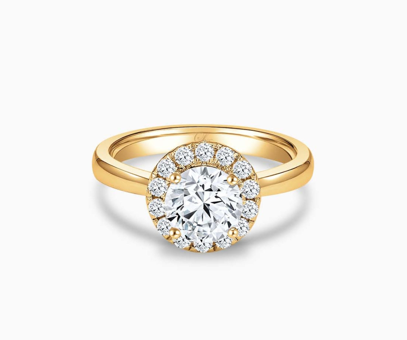 Round cut diamond halo engagement ring set on yellow gold with a tapered plain band design