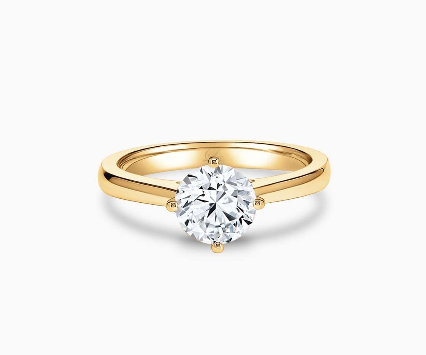 Timeless yellow gold solitaire diamond ring with a classic straight plain band, designed for everyday elegance and lifelong wear