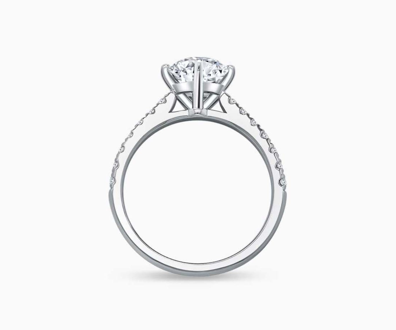 Elegant round-cut solitaire diamond ring with a straight pave white gold band, featuring a brilliant center stone secured by four prongs, accentuated by a row of dazzling smaller diamonds along the band for added sparkle.