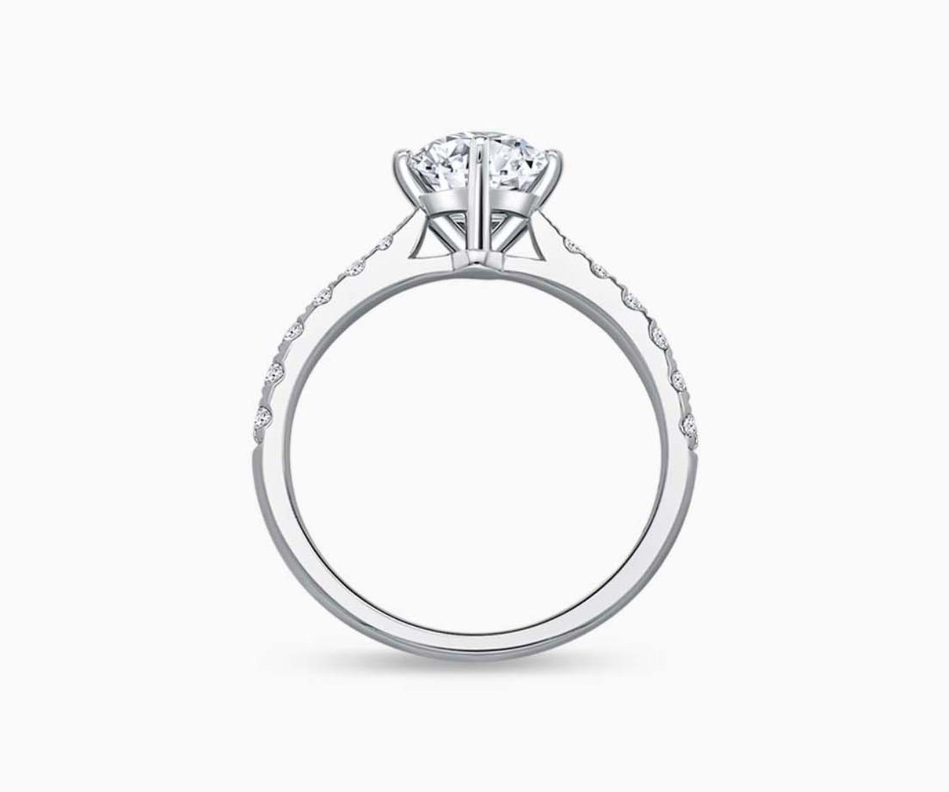 Solitaire diamond ring with a tapered white gold band lined with side diamonds, designed to enhance the center stone's brilliance and elegant appeal.