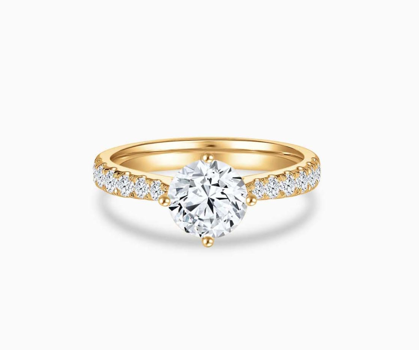 Yellow gold solitaire diamond ring with a tapered pave band lined with side diamonds, enhancing the center stone’s brilliance and elegant appeal