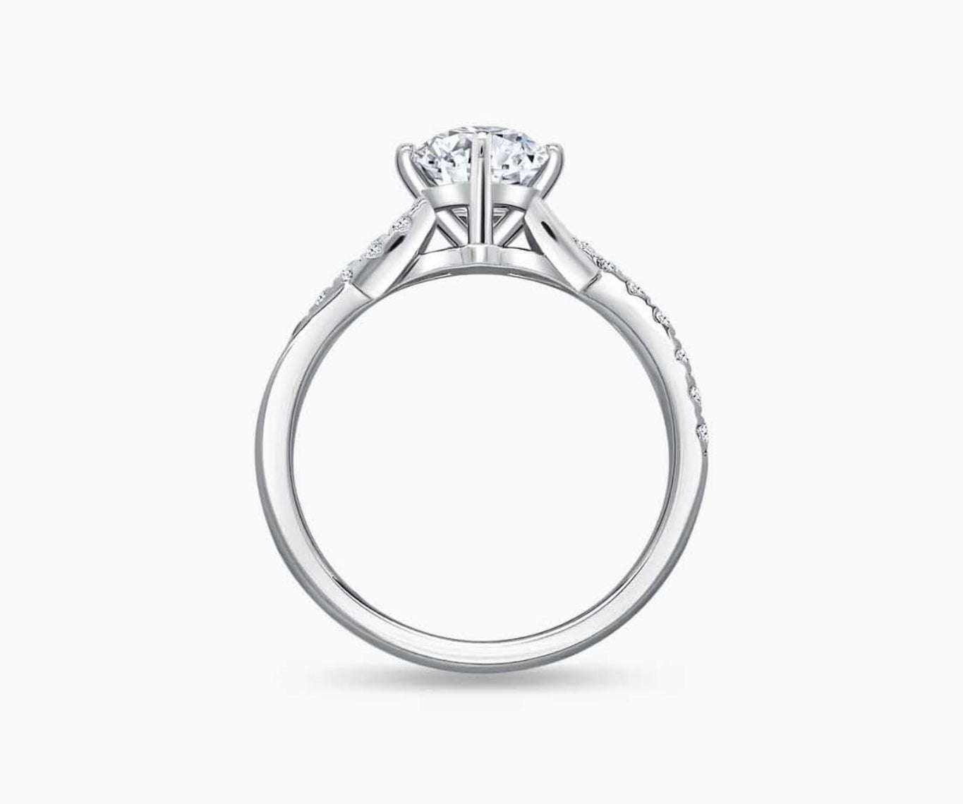 Solitaire diamond ring with a twisted infinity white gold band lined with side diamonds, symbolizing two entwining lives in a romantic and unique design