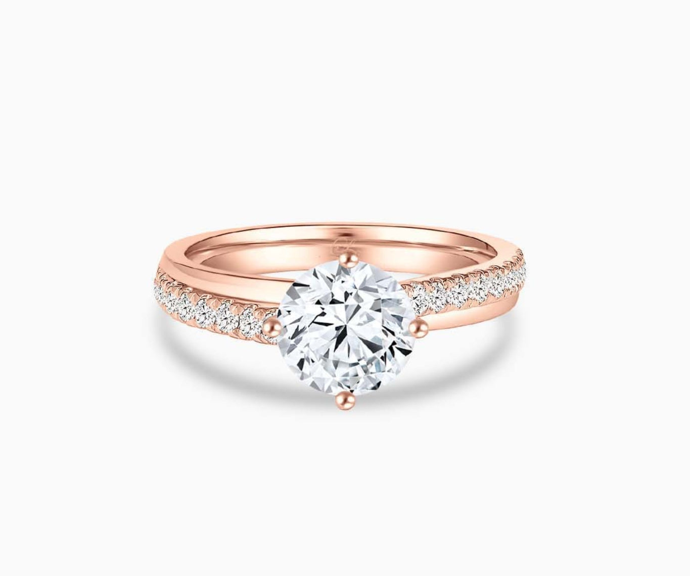 Modern rose gold solitaire diamond ring with a double pave band lined with side diamonds and a subtle center line engraving for a bold and sleek look.
