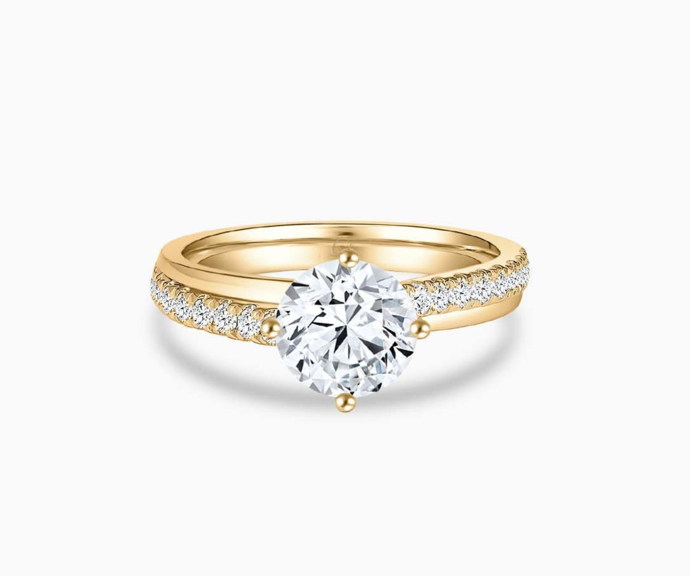 Modern yellow gold solitaire diamond ring with a double pave band lined with side diamonds and a subtle center line engraving for a bold and sleek look