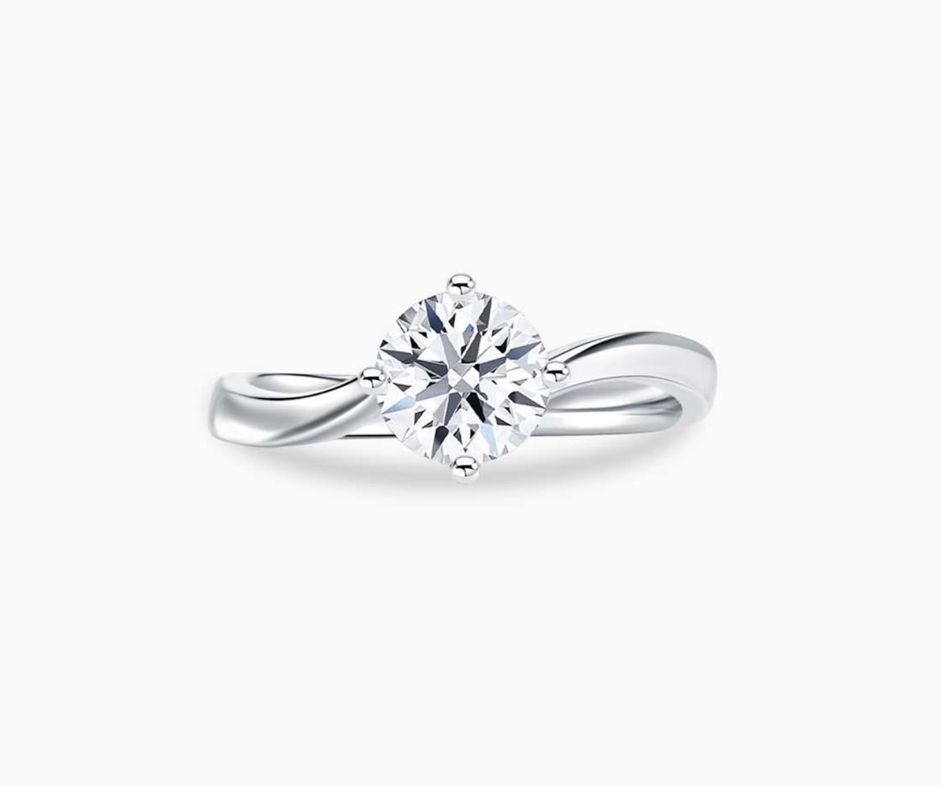 Solitaire diamond ring with a double plain twisted white gold band and a four-prong round-cut center stone