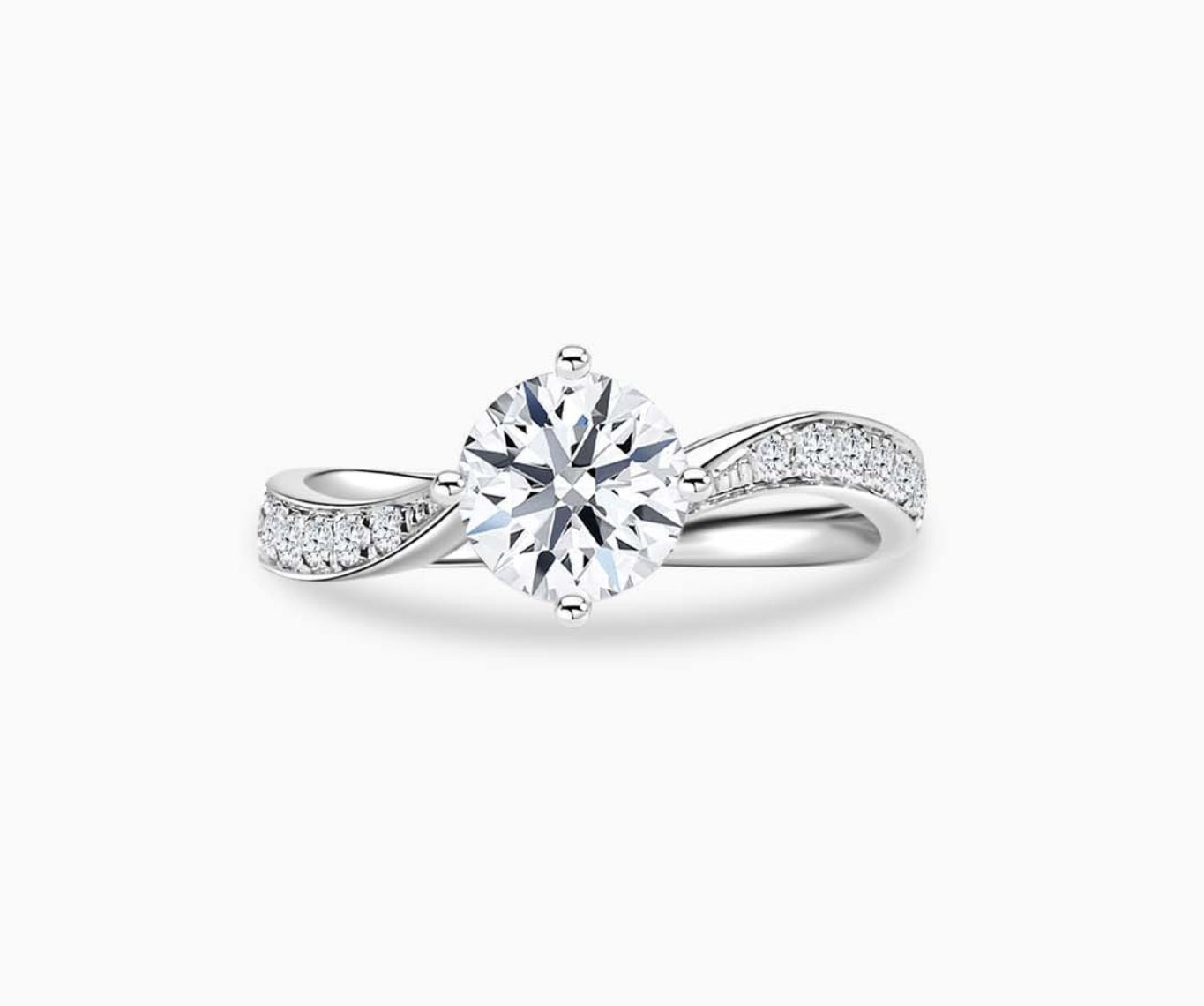 Solitaire diamond ring with a twirl white gold band lined with side diamonds, blending vintage charm with modern elegance to highlight the center stone.