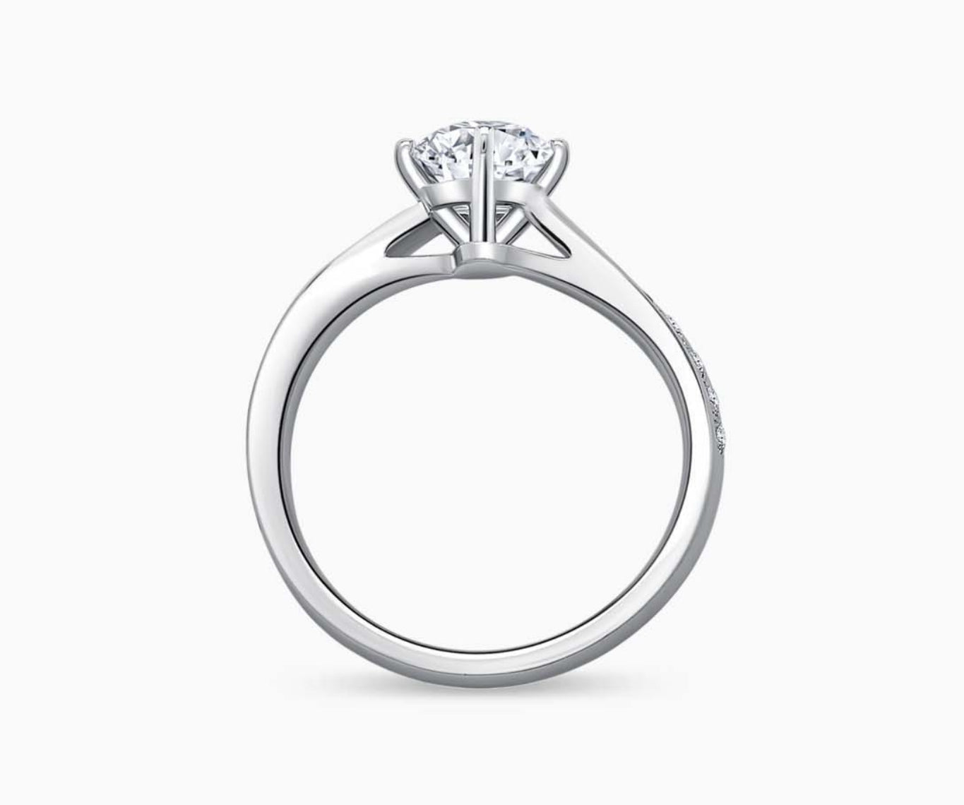 Solitaire diamond ring with a twirl white gold band lined with side diamonds, blending vintage charm with modern elegance to highlight the center stone.