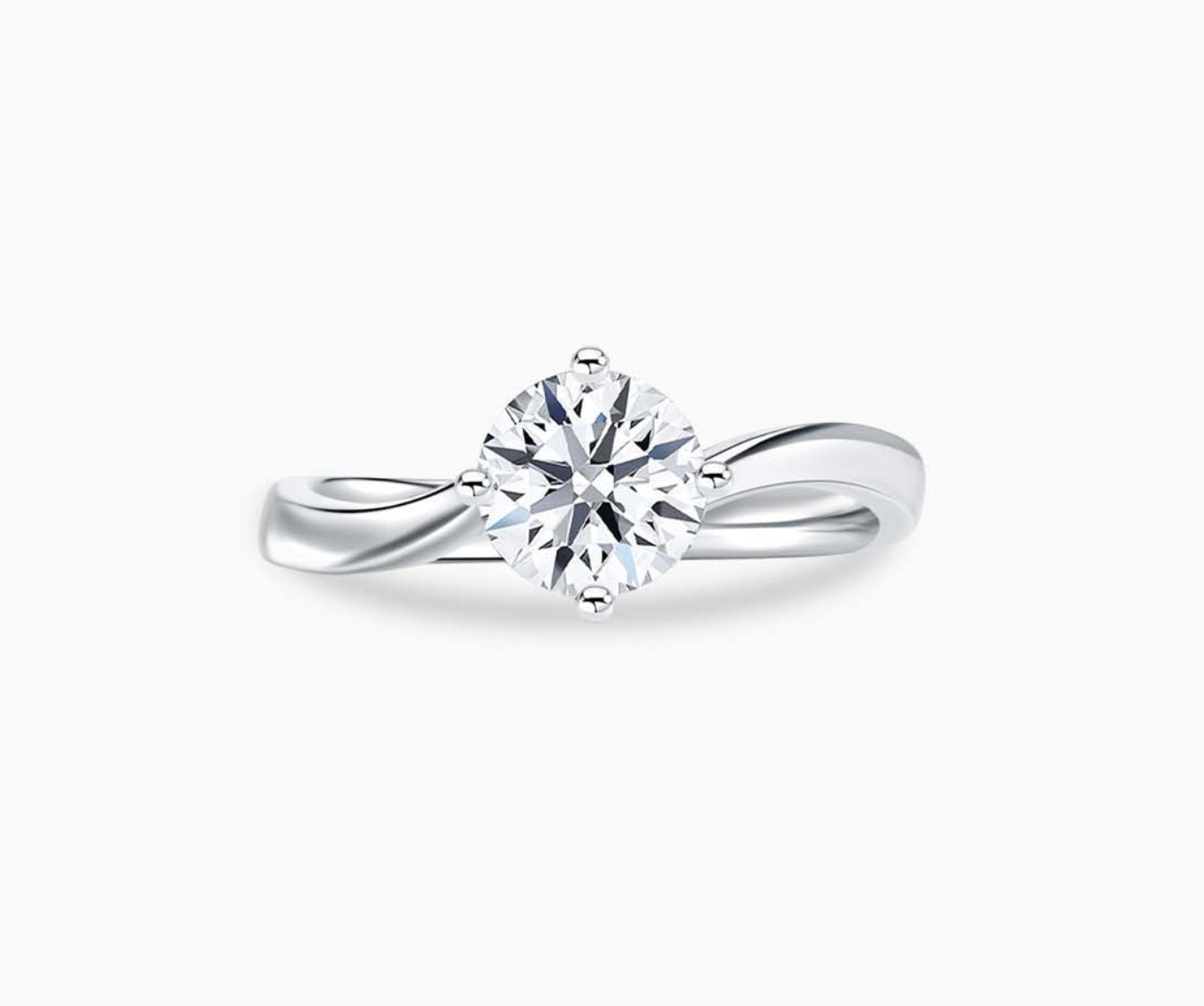 Solitaire diamond ring with a sleek twirl band in white gold, blending vintage charm with modern elegance to accentuate the center stone.