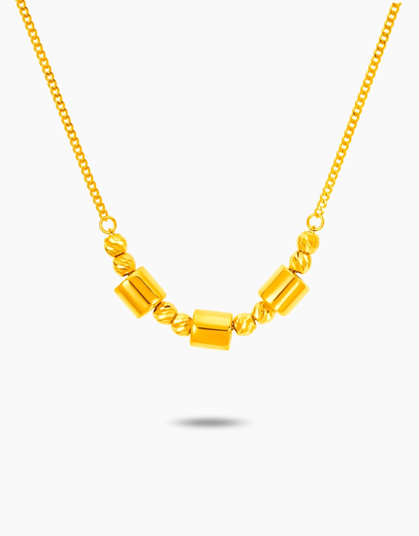 LVC necklace in 999 gold with small circles and cylinder cubes as charms