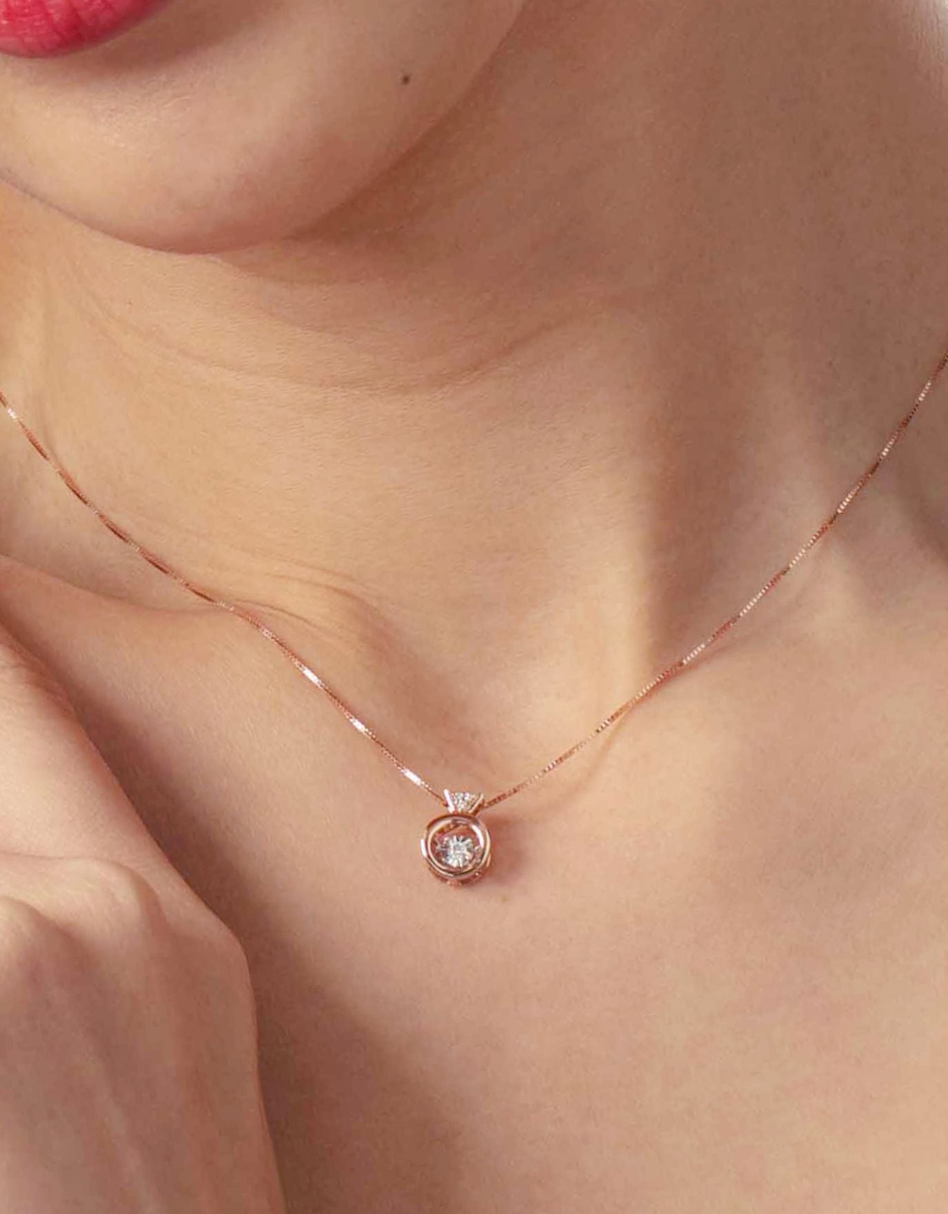 LVC Diamond necklace for women crafted with a centerpiece dancing diamond in rose gold worn by a woman